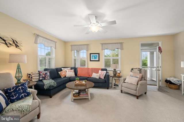 living room with light colored carpet and ceiling fan