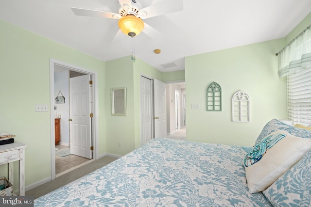 bedroom featuring light carpet, a closet, and ceiling fan