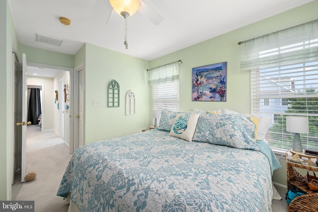 carpeted bedroom with ceiling fan