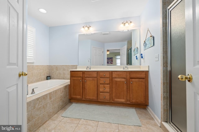 bathroom with vanity, tile patterned floors, and separate shower and tub