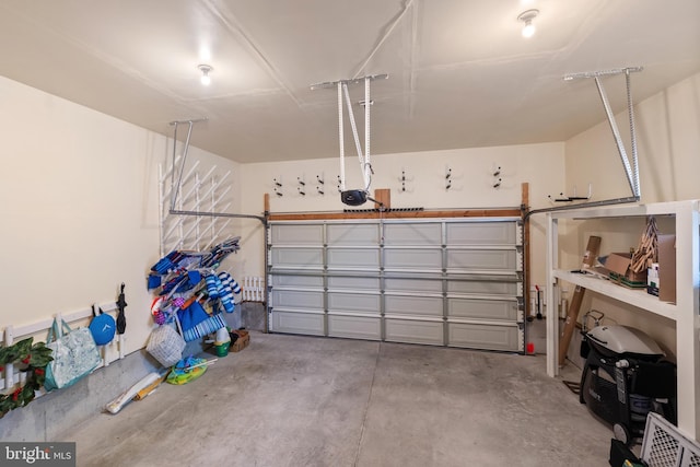 garage featuring a garage door opener