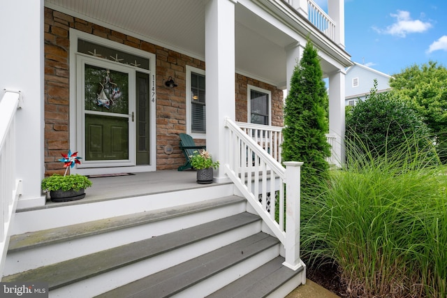 entrance to property with a porch