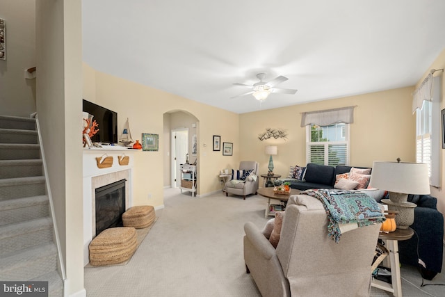 living room with light carpet and ceiling fan