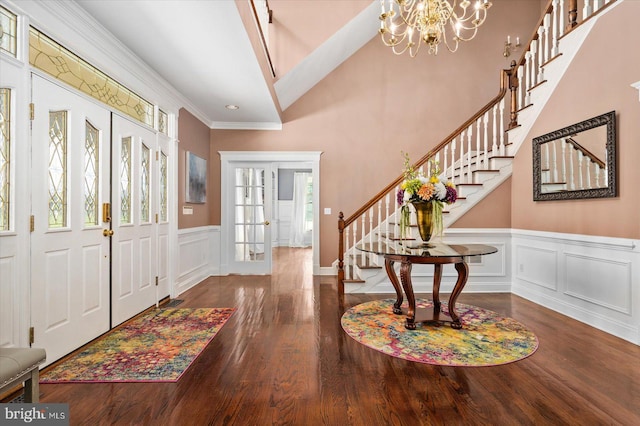 entrance foyer featuring an inviting chandelier and hardwood / wood-style floors