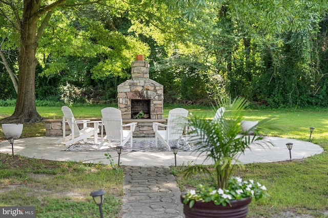 view of patio / terrace with an outdoor stone fireplace