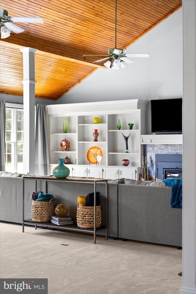 carpeted living room with lofted ceiling, wood ceiling, and ceiling fan