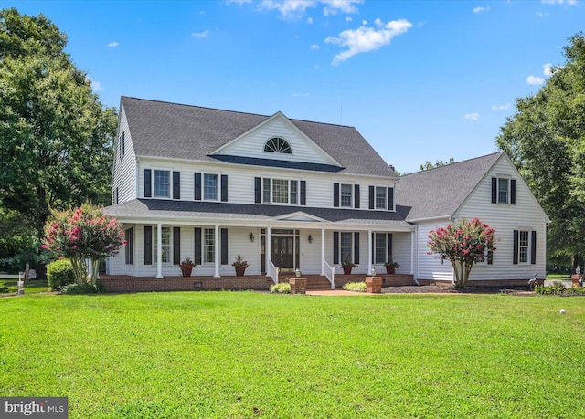 view of front of house with a porch and a front lawn