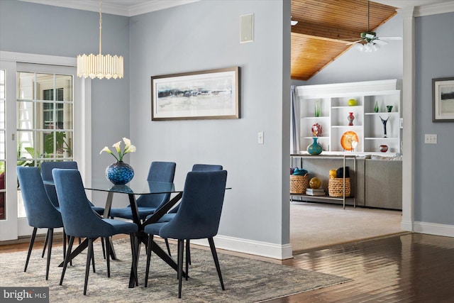 dining area with lofted ceiling, hardwood / wood-style flooring, ceiling fan, wood ceiling, and crown molding