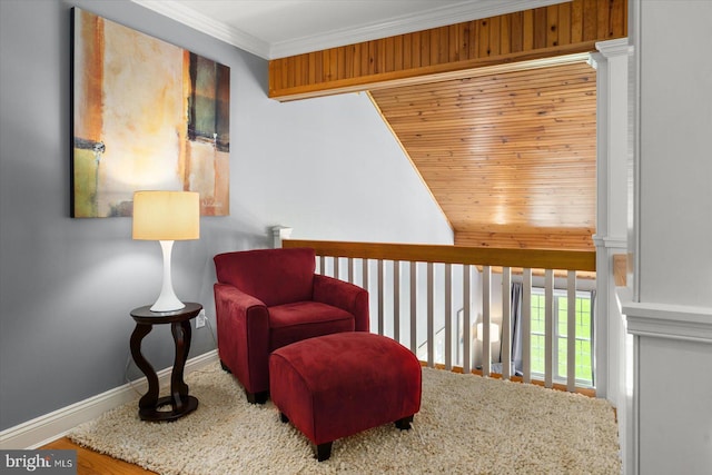 living area featuring crown molding