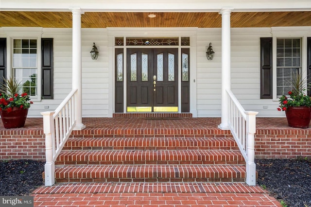 doorway to property featuring a porch