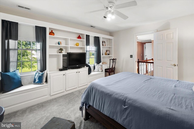 bedroom featuring ceiling fan and carpet