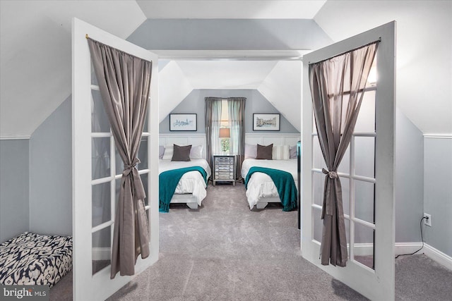 bedroom with carpet, lofted ceiling, and french doors