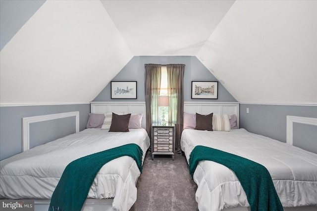 carpeted bedroom featuring vaulted ceiling