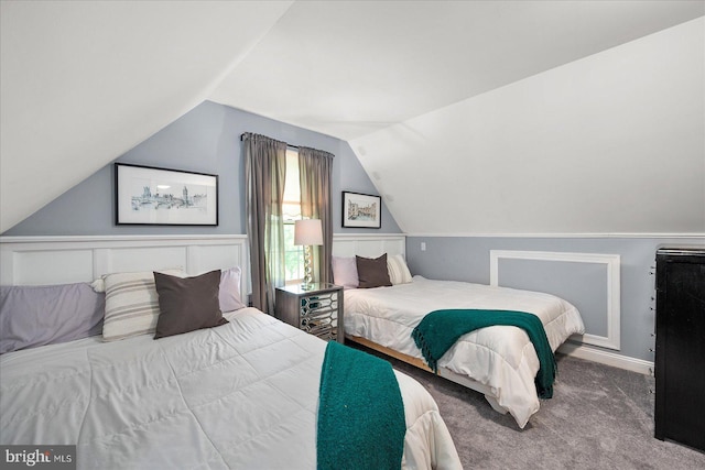 carpeted bedroom featuring vaulted ceiling