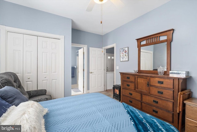 bedroom with connected bathroom, ceiling fan, and a closet