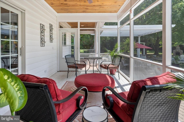 sunroom / solarium featuring wooden ceiling