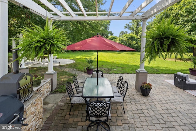 view of patio with a pergola and exterior kitchen