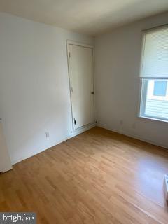 spare room featuring light hardwood / wood-style flooring