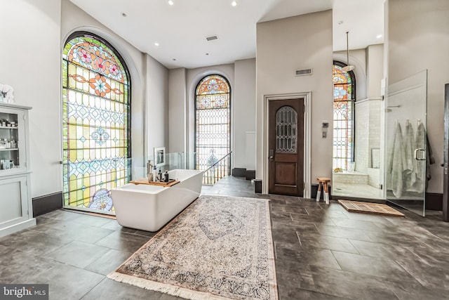 foyer entrance with visible vents