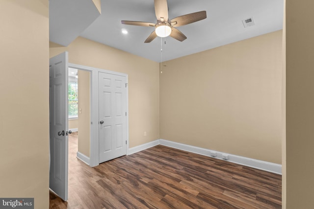 spare room with ceiling fan and hardwood / wood-style floors