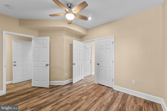 unfurnished bedroom featuring hardwood / wood-style floors and ceiling fan