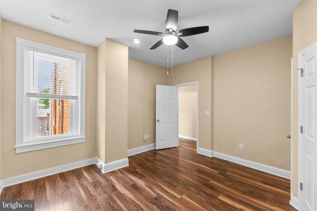 unfurnished bedroom with ceiling fan and hardwood / wood-style flooring