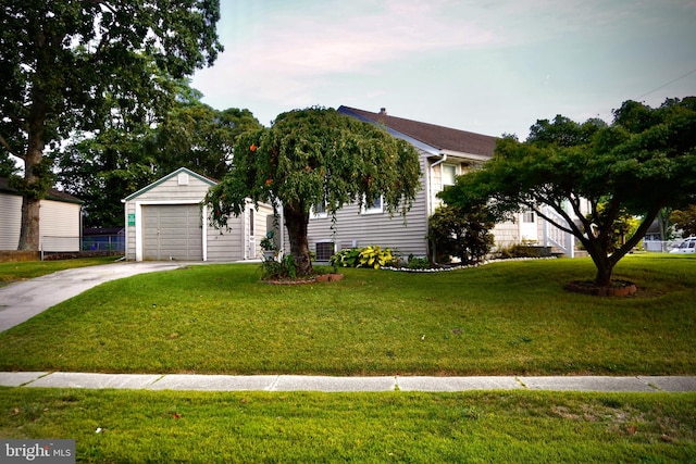 view of front of house with a garage and a front lawn