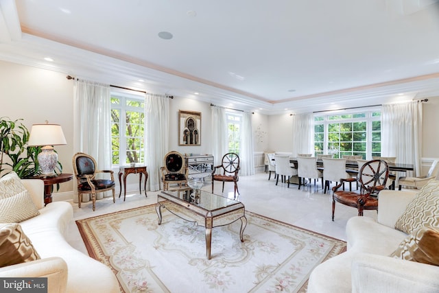 tiled living room featuring crown molding