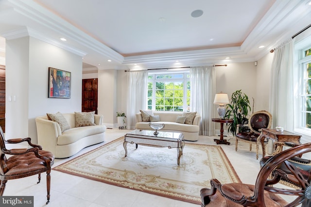 living room featuring light tile patterned floors, crown molding, and a raised ceiling