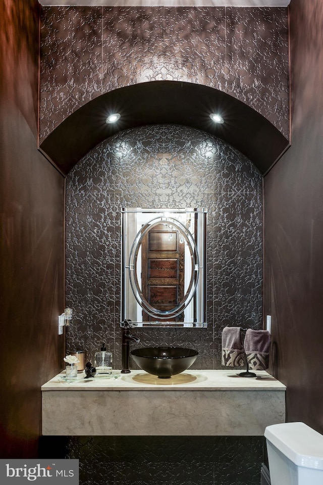 bathroom featuring vanity and toilet