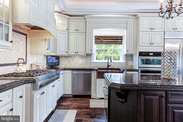 kitchen with white cabinetry, appliances with stainless steel finishes, dark wood-type flooring, and decorative backsplash