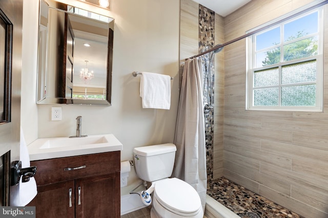 bathroom featuring vanity, a chandelier, toilet, and a shower with shower curtain