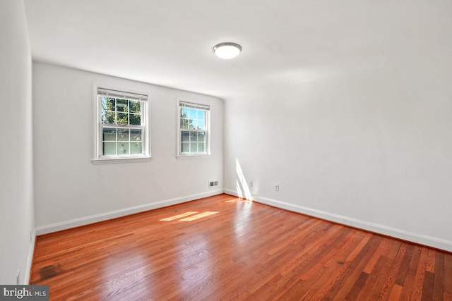 empty room featuring hardwood / wood-style flooring