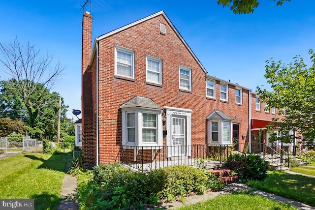 view of front of home with a front lawn