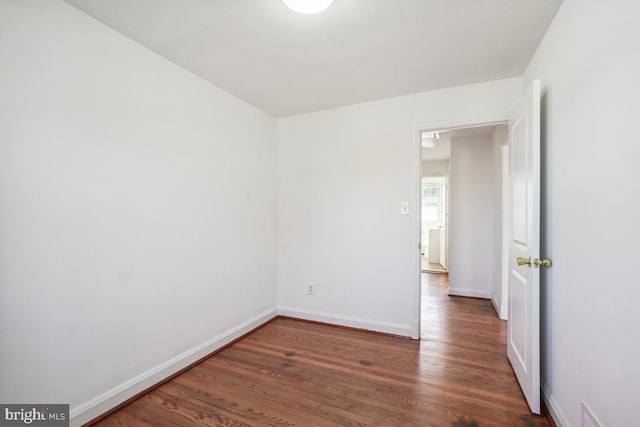 spare room featuring dark hardwood / wood-style floors