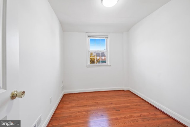 empty room featuring wood-type flooring