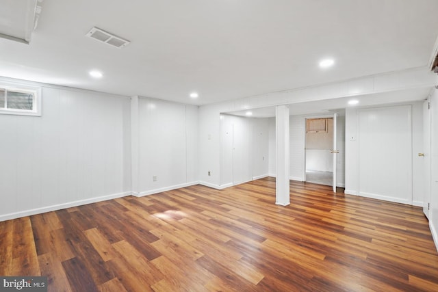 basement featuring hardwood / wood-style floors