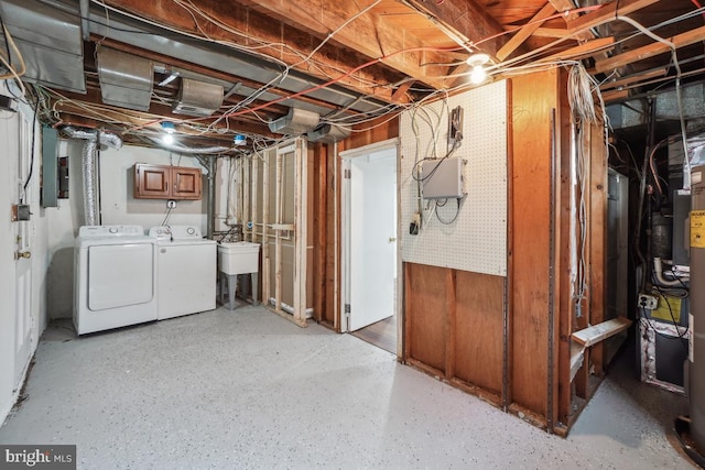 basement featuring sink and washer and clothes dryer