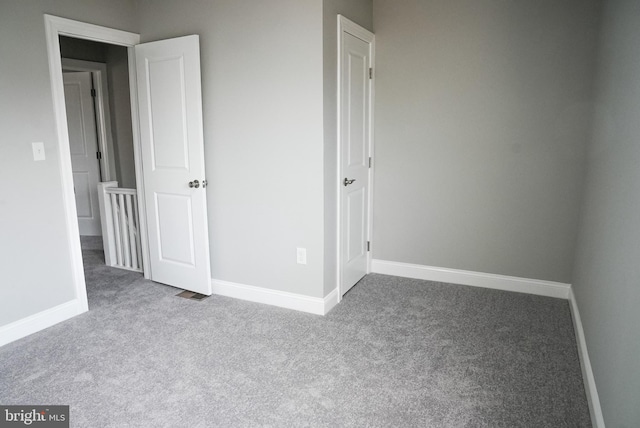 unfurnished bedroom with carpet