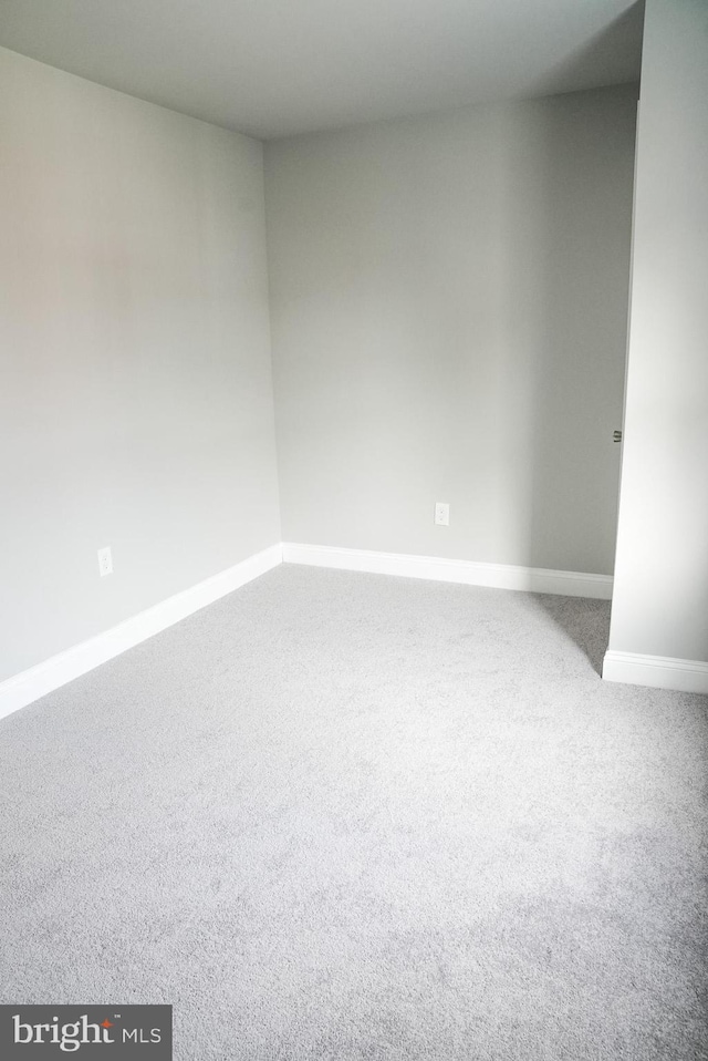 empty room with carpet flooring