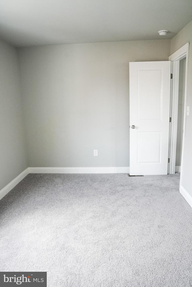 unfurnished room featuring carpet floors