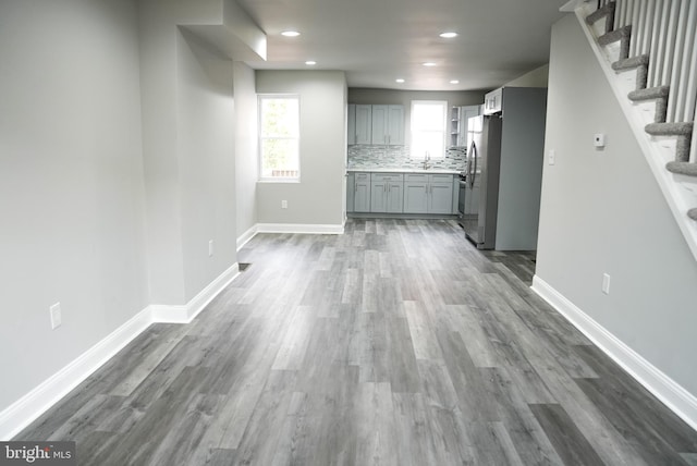 unfurnished living room featuring dark hardwood / wood-style flooring