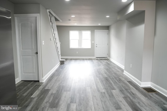 spare room featuring wood-type flooring