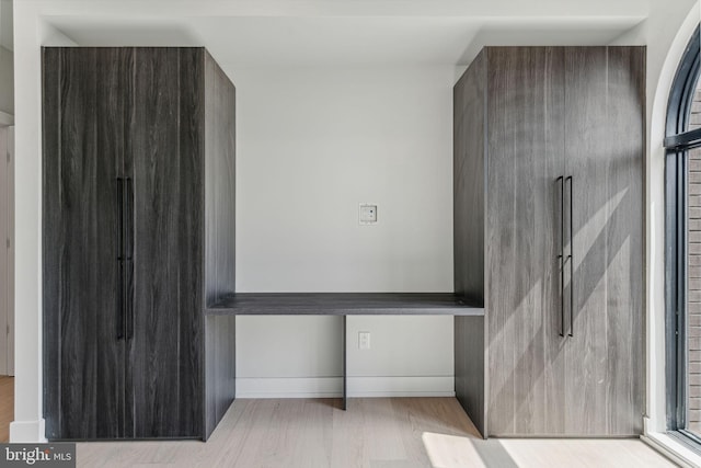 bathroom with hardwood / wood-style floors