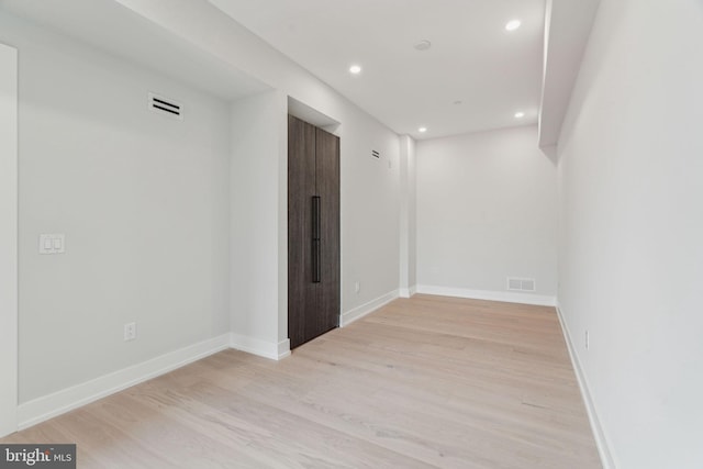 unfurnished room featuring light hardwood / wood-style flooring