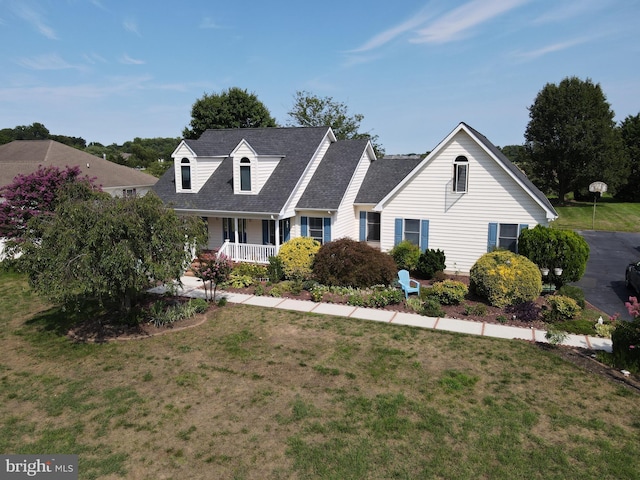 cape cod-style house with a porch and a front lawn