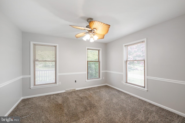 carpeted empty room with ceiling fan