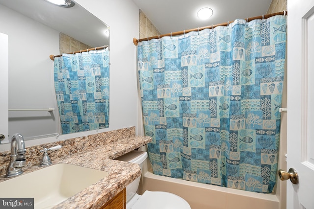 full bathroom featuring vanity, toilet, and shower / bathtub combination with curtain