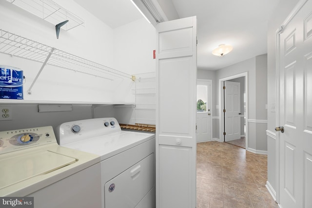 laundry room featuring washing machine and dryer