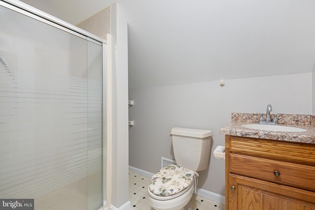 bathroom featuring vanity, a shower with shower door, lofted ceiling, and toilet